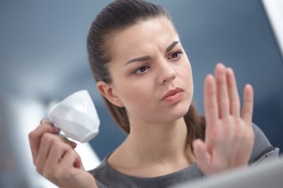 woman looking at her nails