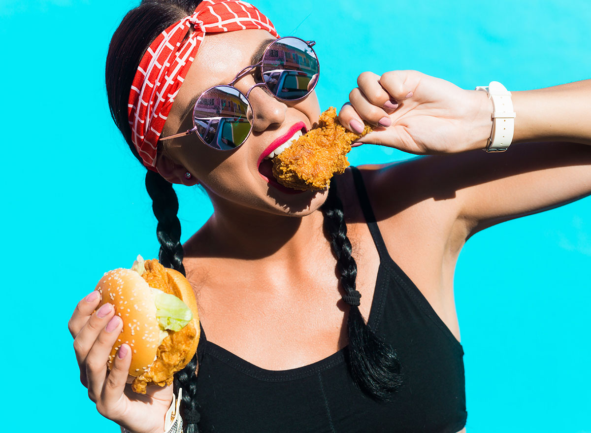 woman eating fried chicken