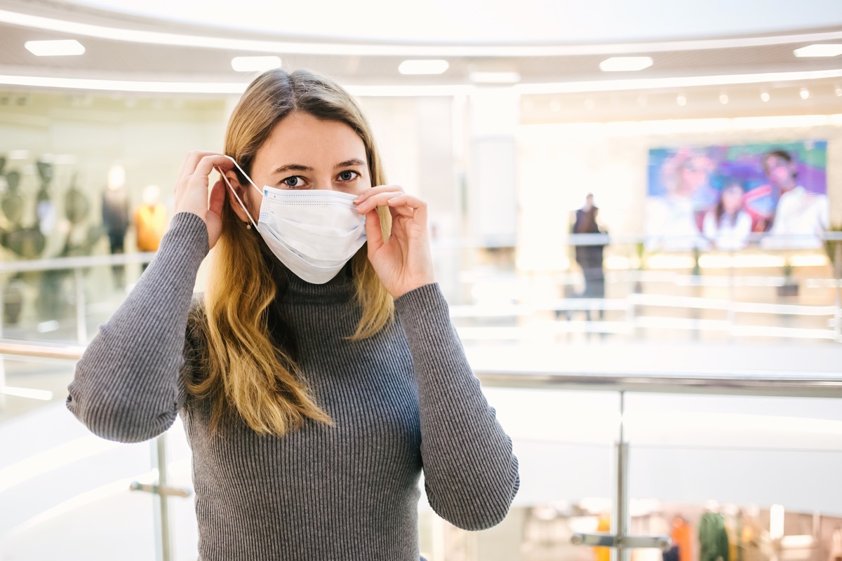 Woman with medical mask to protect her from virus