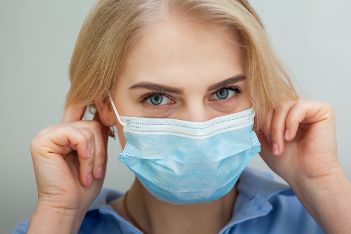 woman with a surgical mask on her face