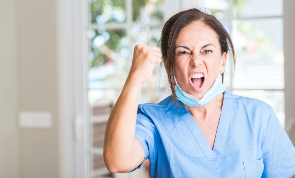 doctor woman annoyed and frustrated shouting with anger