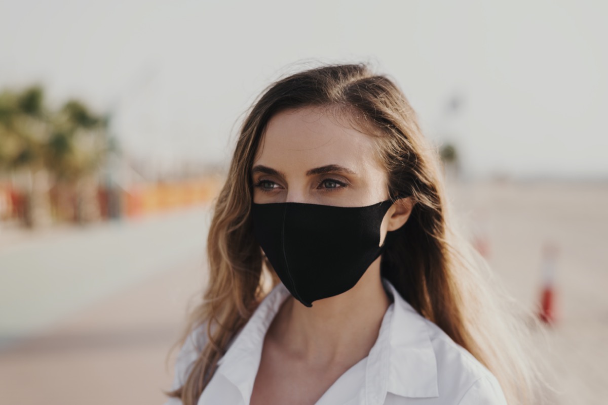 woman wearing black protective face mask