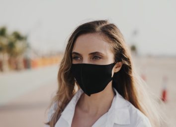 woman wearing black protective face mask