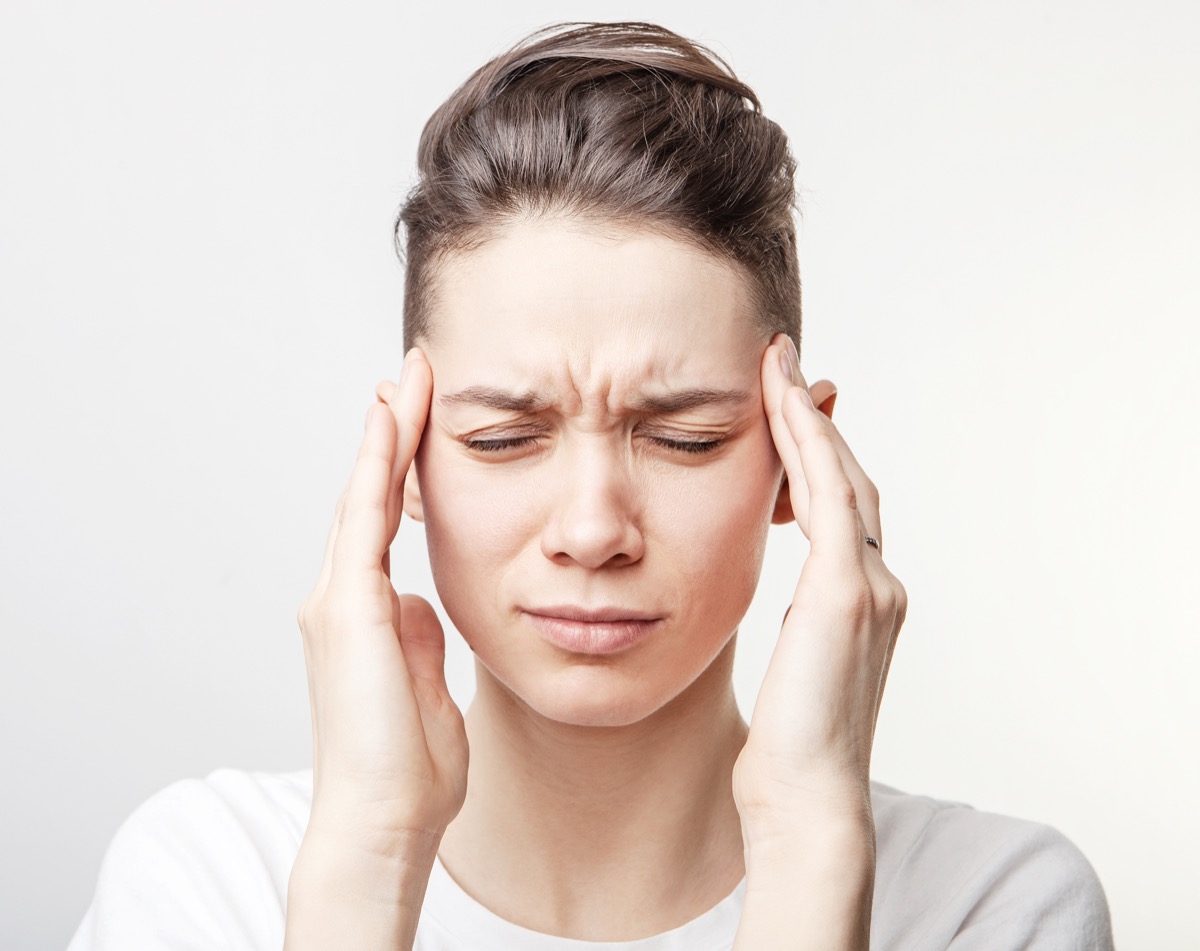 Woman migraine covid