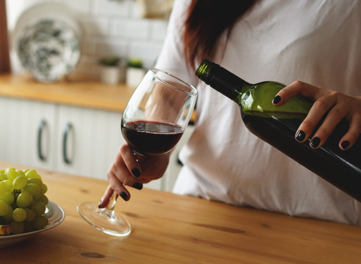 woman pouring glass of wine