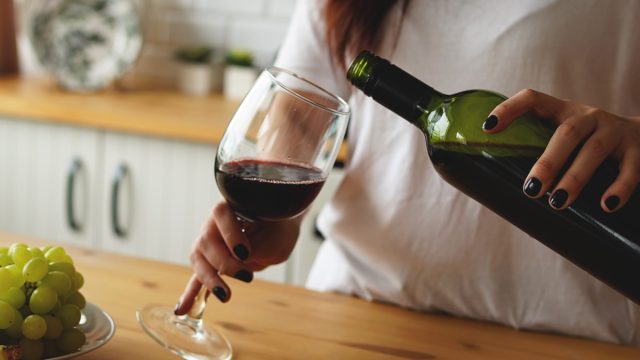 woman pouring glass of wine