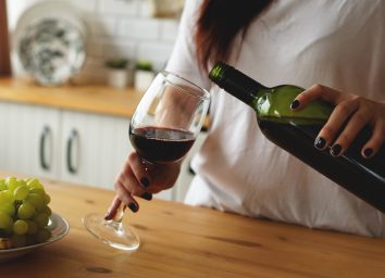 woman pouring glass of wine