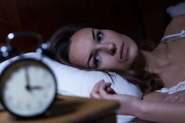30-something woman having trouble sleeping