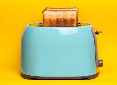blue toaster with slices of toast