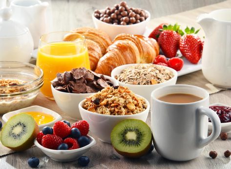 breakfast buffet with pastries fruit and cereal
