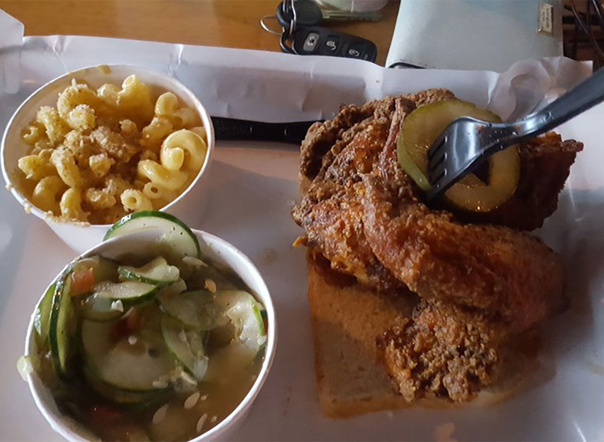 fried chicken sandwich with cucumber salad and mac and cheese