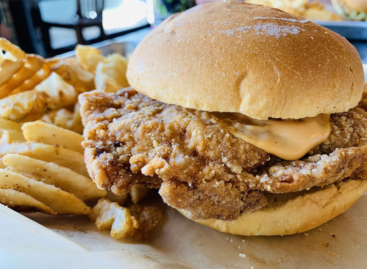 fried chicken sandwich with french fries
