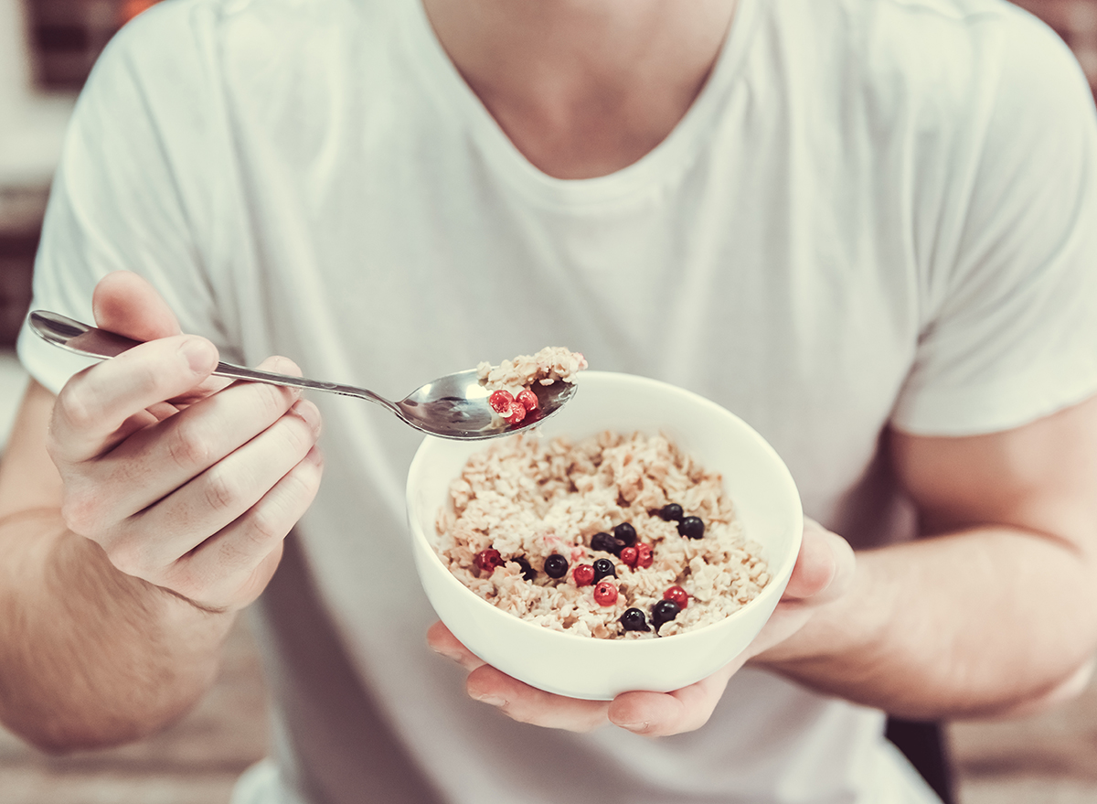 man holding bowl of oatmeal