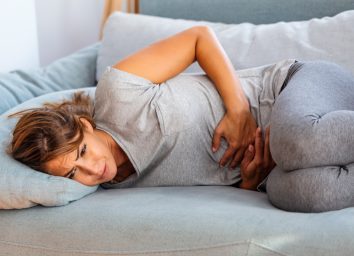 woman suffering from stomach pain