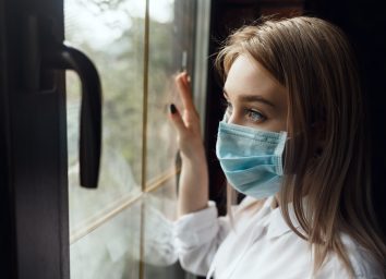 Woman home isolation quarantine wearing face mask