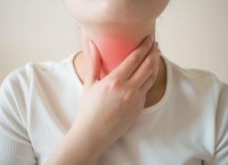 Sick women suffering from sore throat