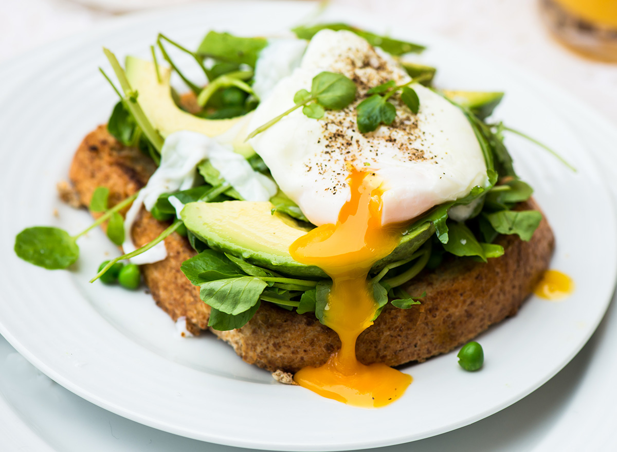 healthy breakfast toast with soft boiled egg and avocado