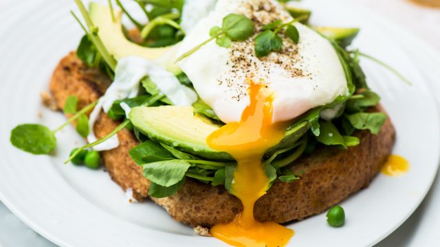 healthy breakfast toast with soft boiled egg and avocado