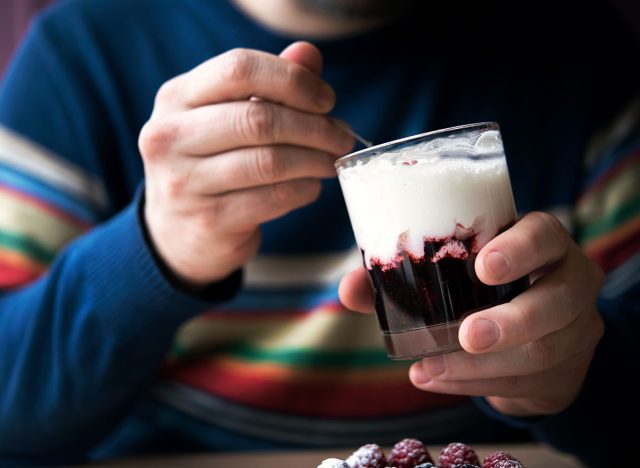 man eating yogurt