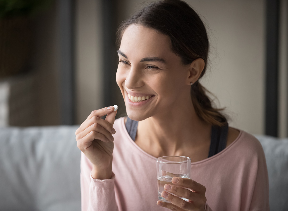 woman taking a multivitamin