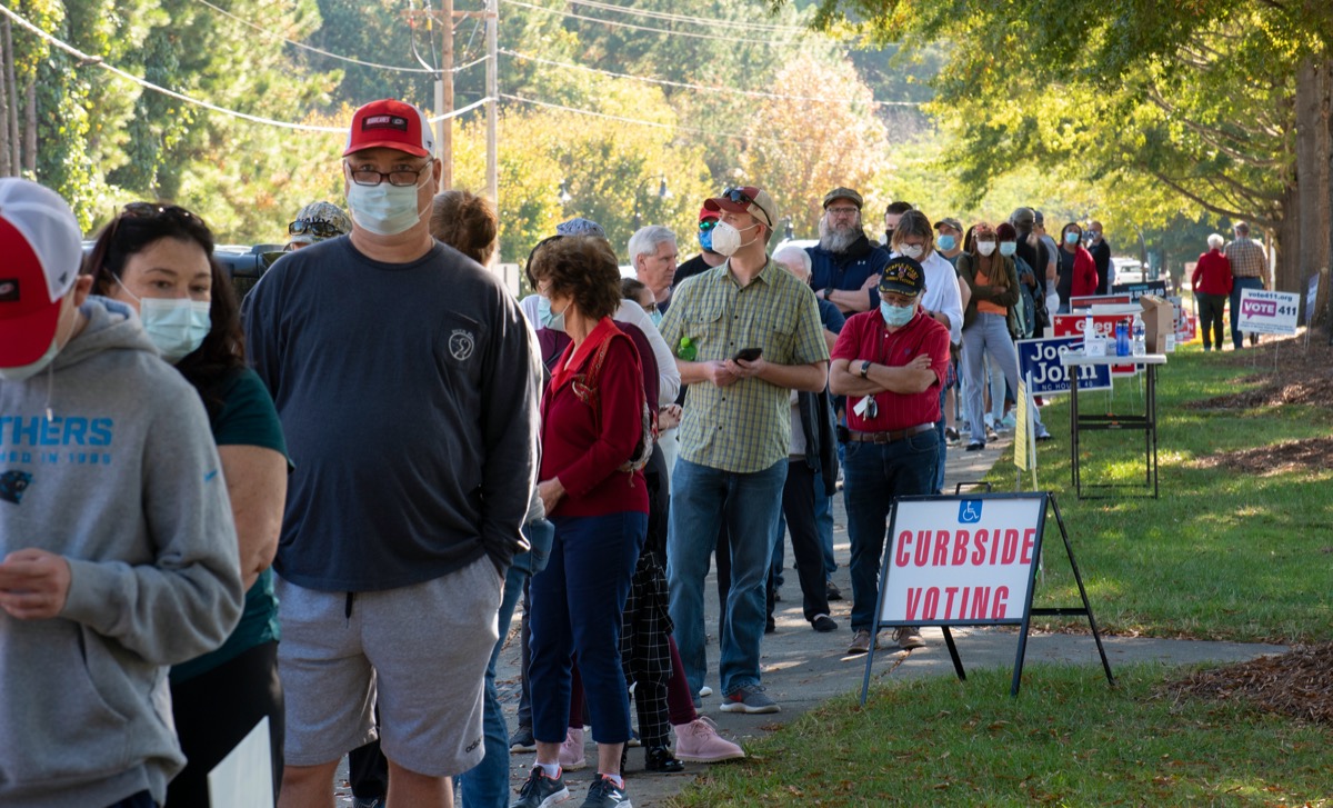 Wake Forest, NC/United States- 10/15/2020: North Carolina voters stand in very long lines to cast their ballots on the first day of early voting.