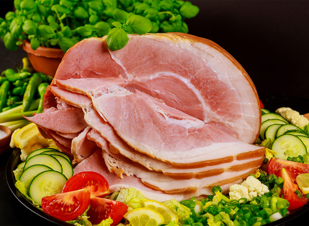 spiral ham on a platter with fresh vegetables