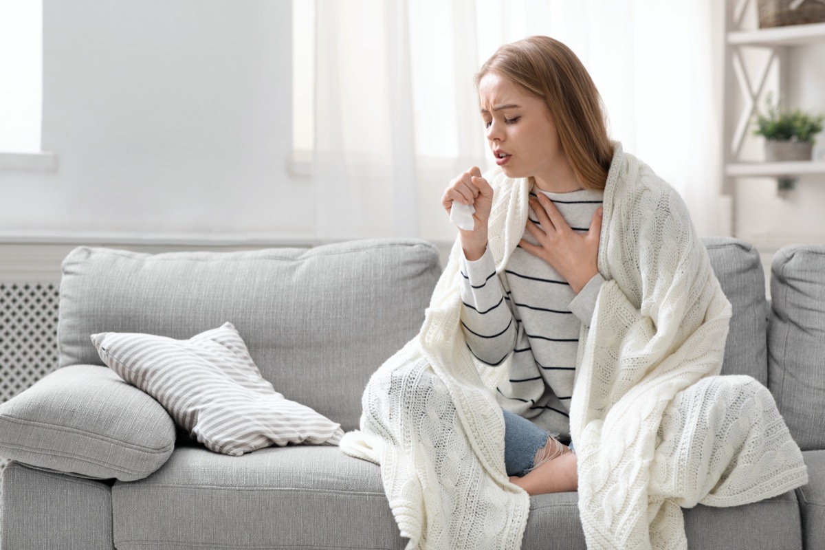 Woman coughing hardly at home