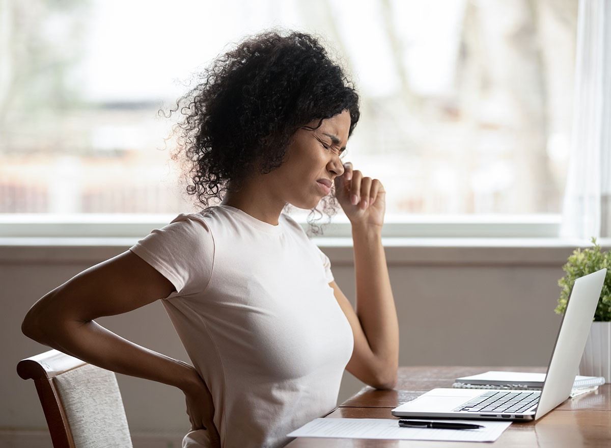 woman in pain sitting