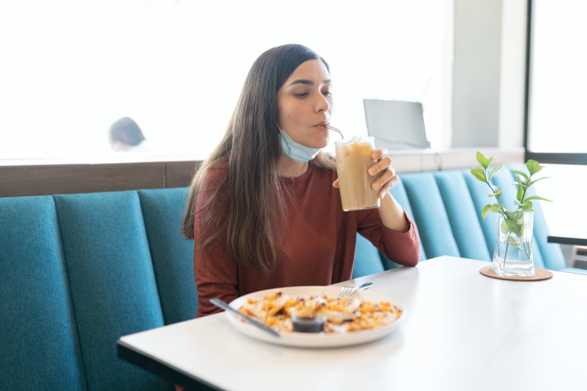 Young Hispanic Woman Drinking Coffee During Coronavirus Outbreak