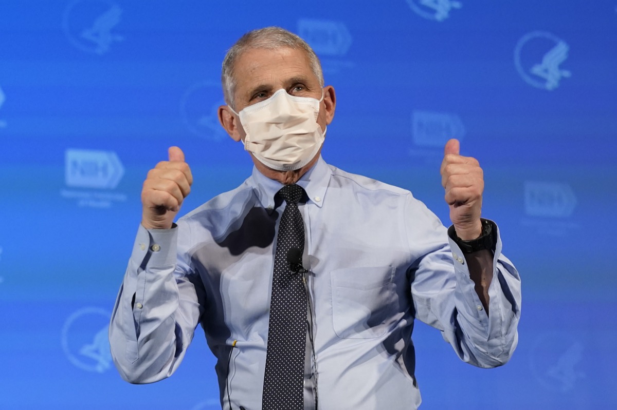 Dr. Anthony Fauci, director of the National Institute of Allergy and Infectious Diseases, gestures after receiving his first dose of the COVID-19 vaccine.