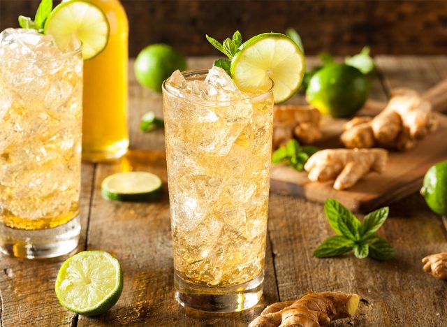 glasses of ginger beer garnished with lime slices