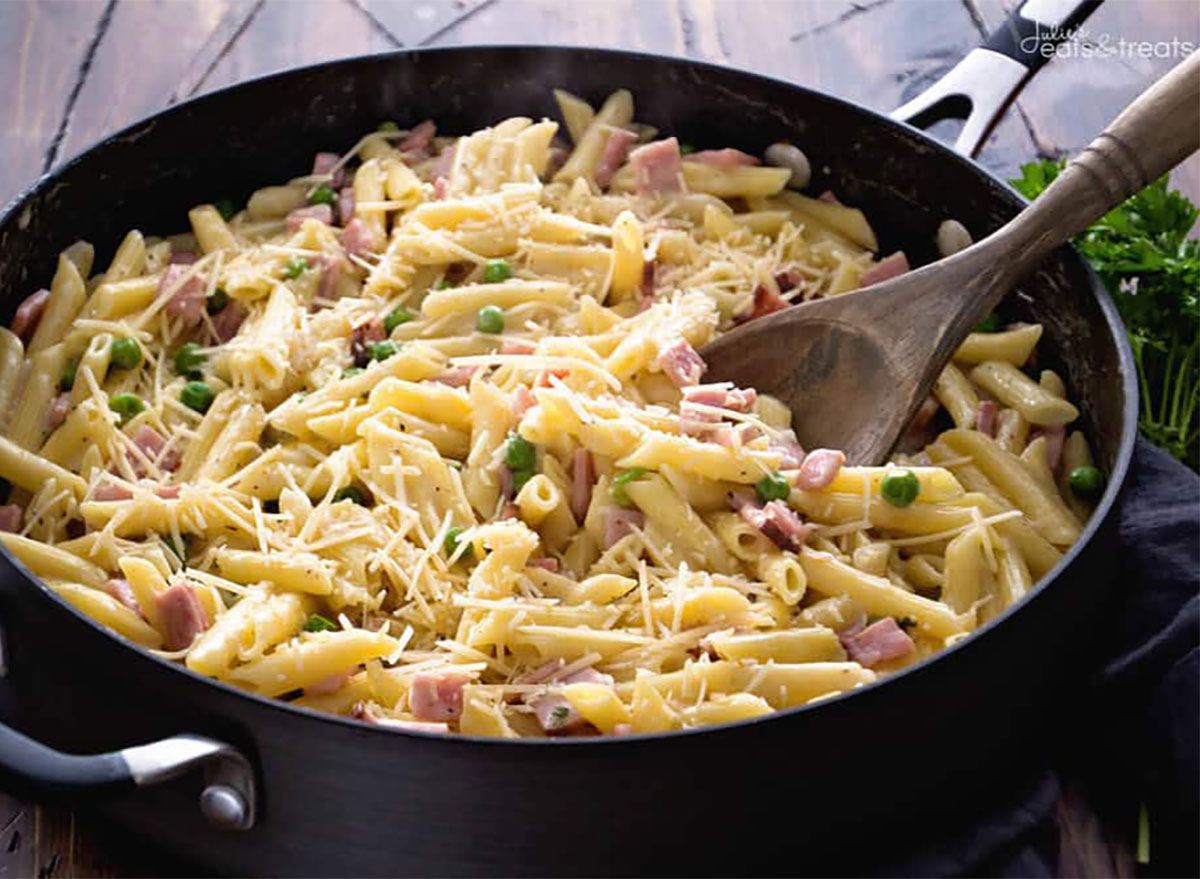 ham cubes and penne pasta in pan