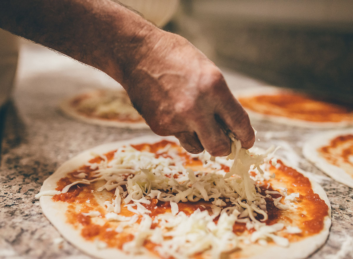 making pizza chunking cheese