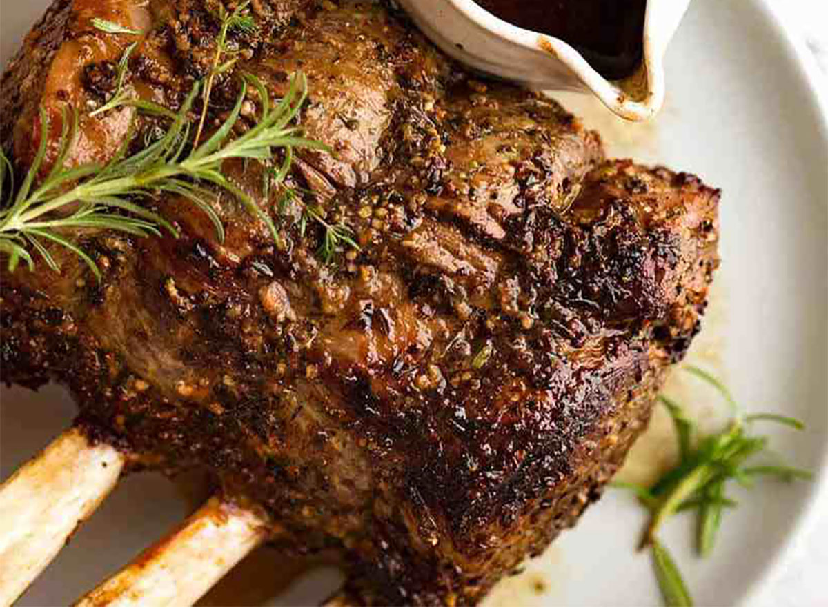 prime rib roast on plate with rosemary