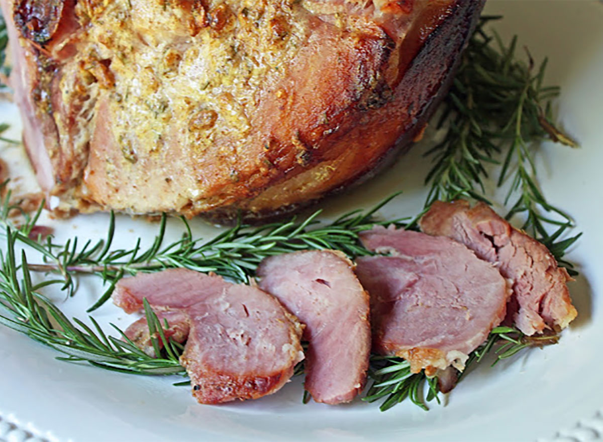 rosemary mustard baked ham slices on plate