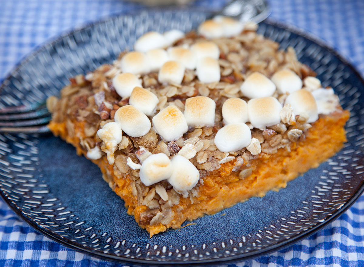 square of sweet potato casserole on blue plate