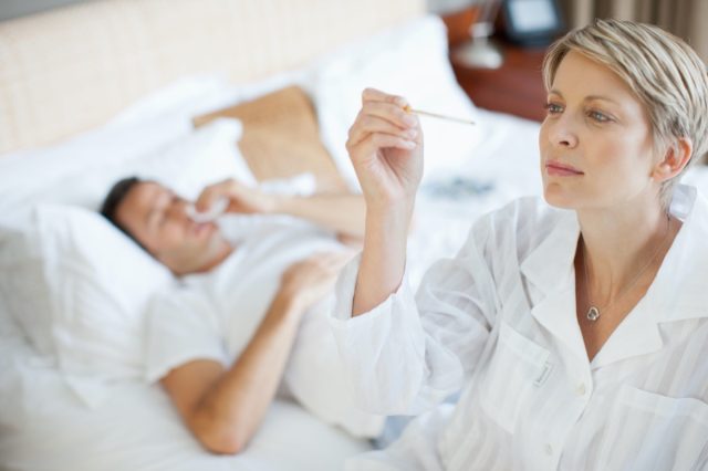 Wife taking wife’s temperature