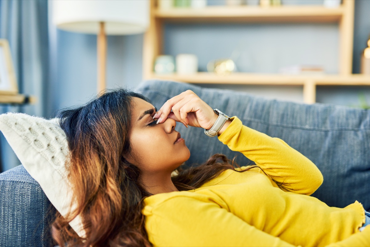 Woman experiencing a bad headache