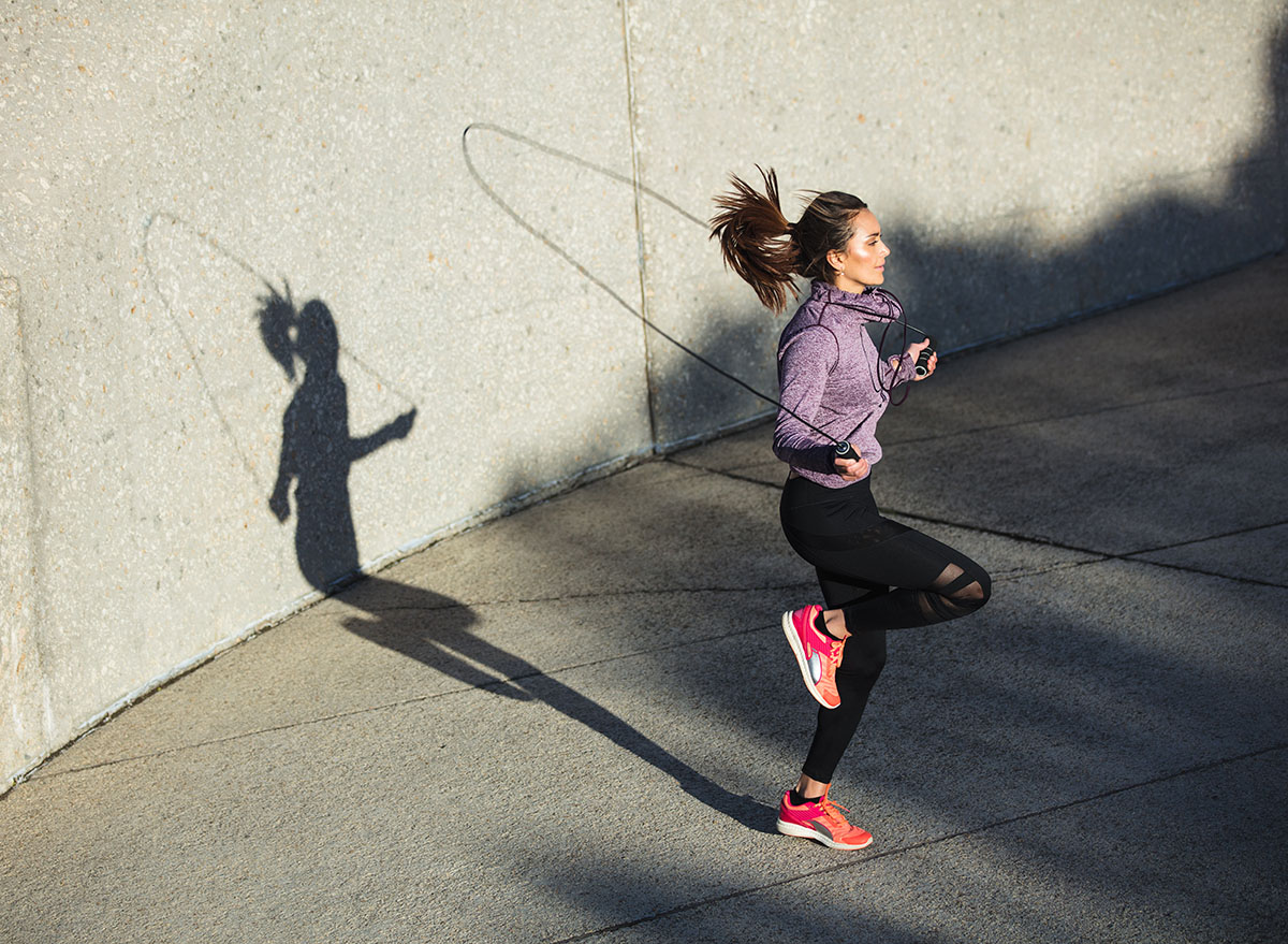 woman jumping rope outside