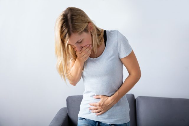 Woman Suffering From Nausea