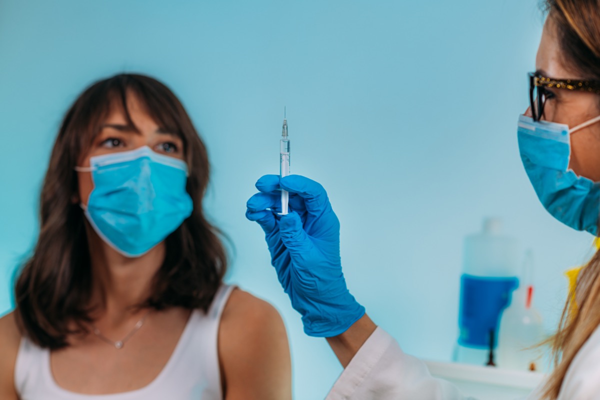 Woman vaccine face mask doctor nurse office