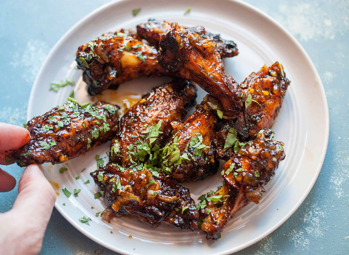 chicken wings topped with scallions