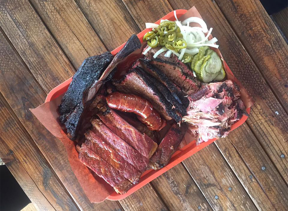 plate of barbecue with pickled veggies