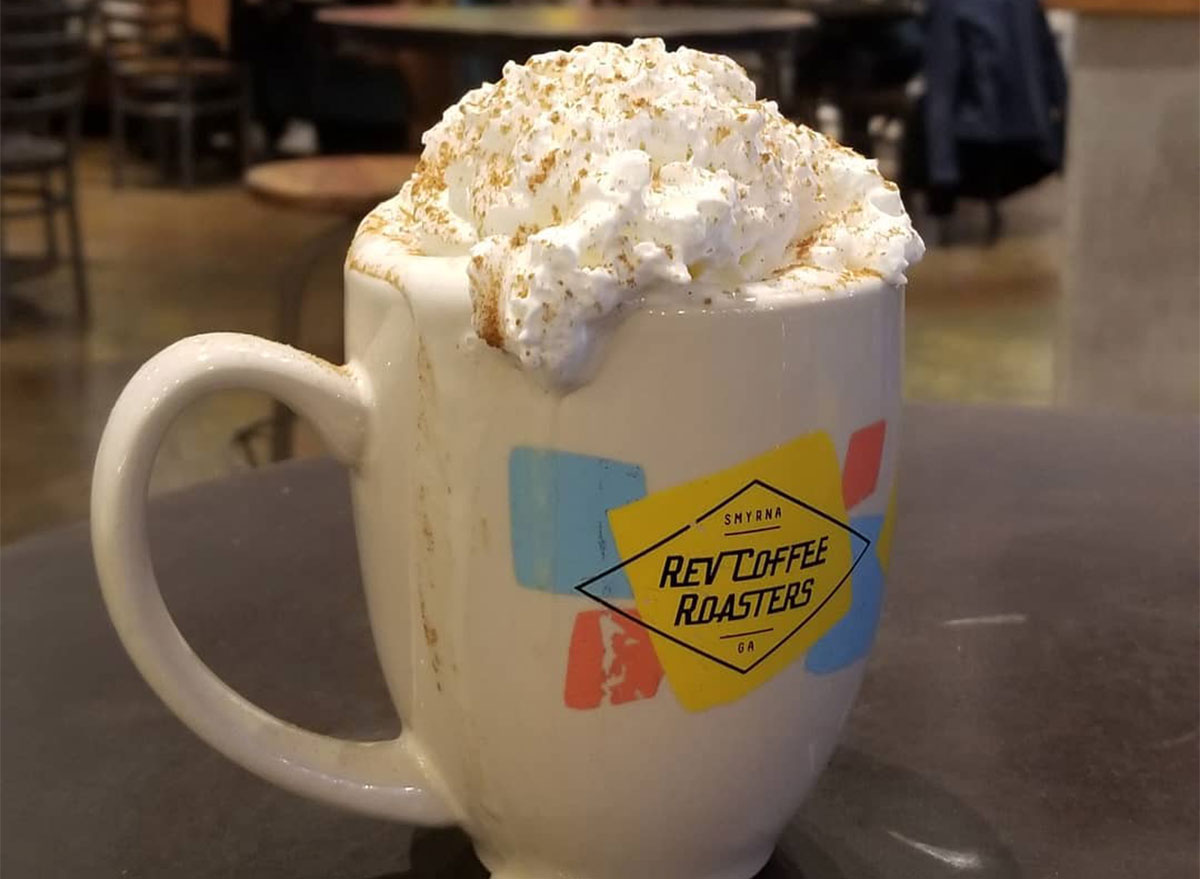 mug of coffee topped with whipped cream