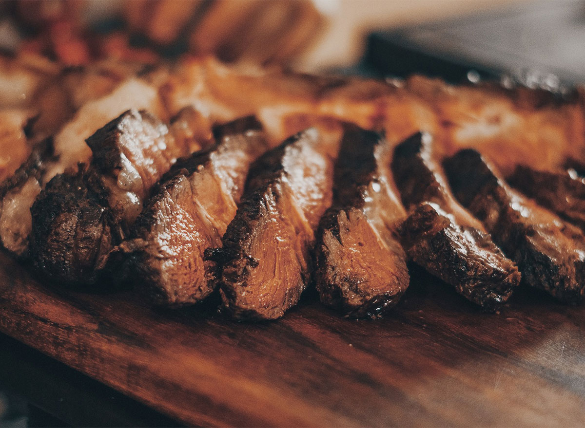 sliced steak on cutting board