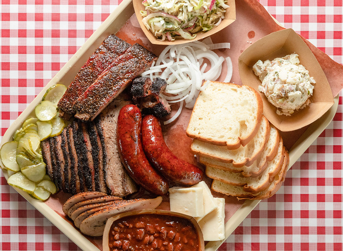 tray of texas barbecue with bread brisket hot links