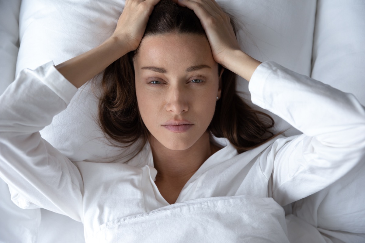 Woman covid migraine