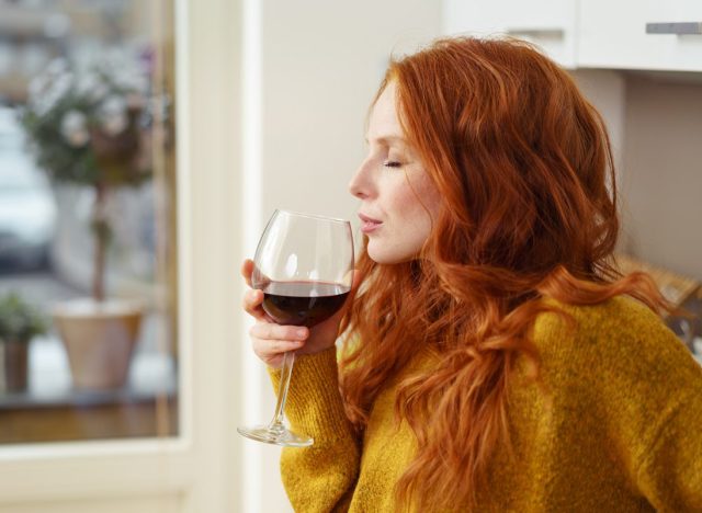 woman drinking wine alcohol at home