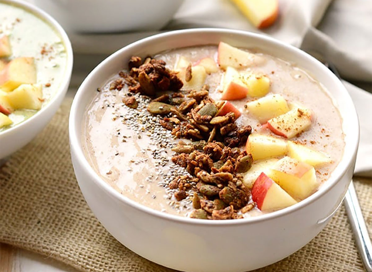 apple pie smoothie bowl topped with apple pieces and chia seeds