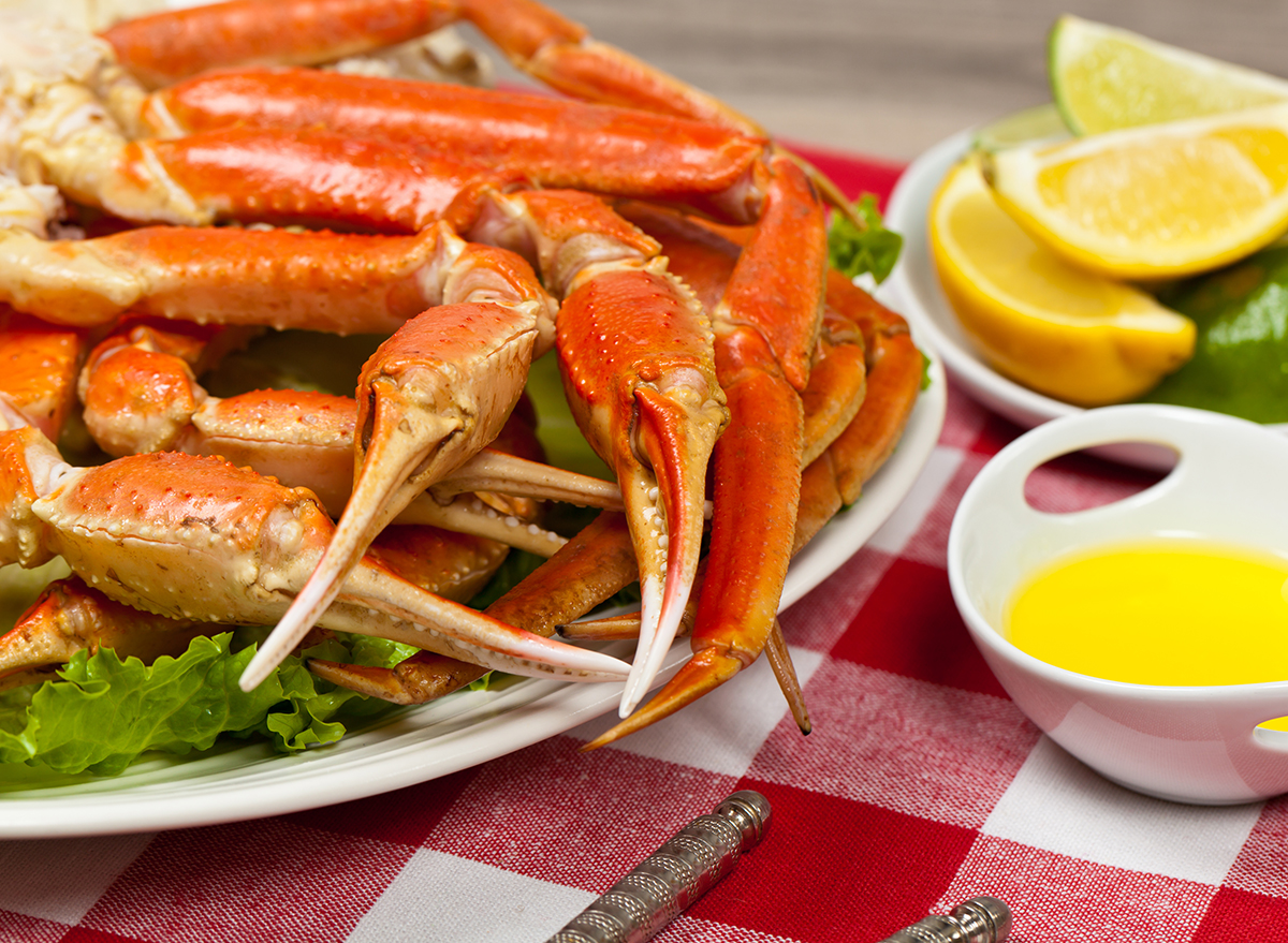 crab legs on plate with lemon and butter